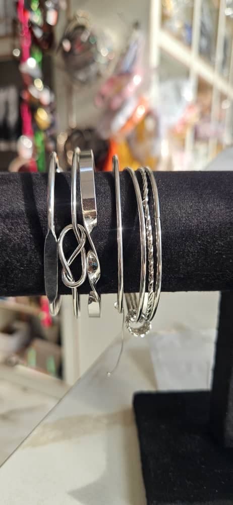 Stacked silver bracelets